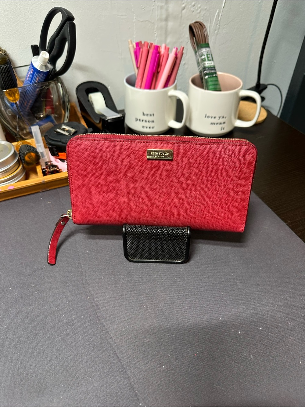 kate spade red zip-around Saffiano wallet with gold plaque